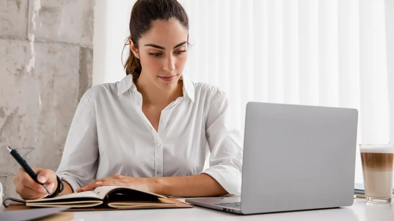 businesswoman working with laptop and notebook