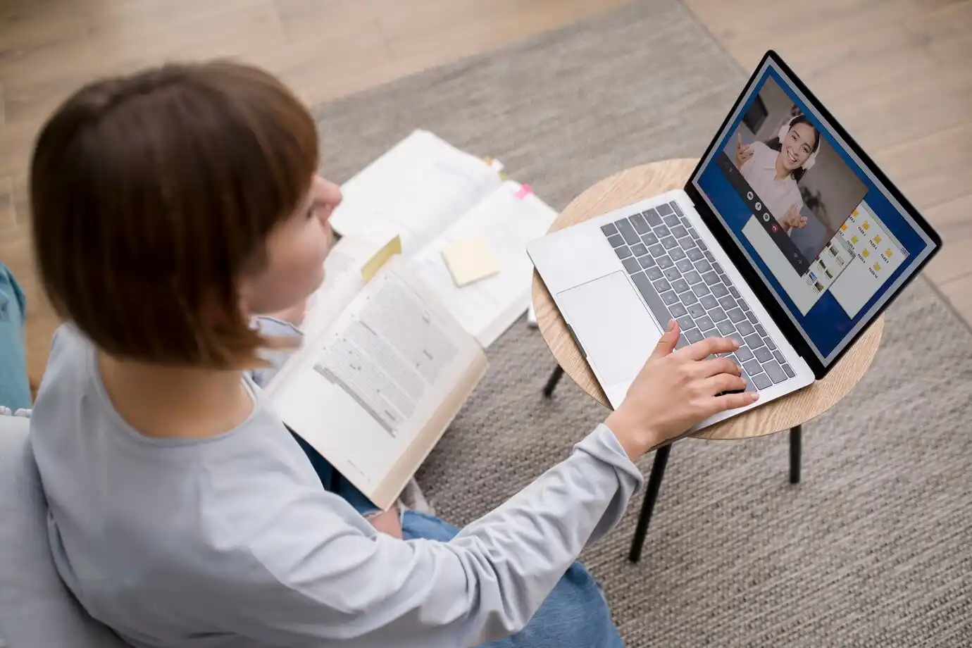 Person attending an online class on a laptop